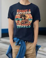 Paws And Waves Dog Beach Graphic T-Shirt Cute Summer Tee - model wearing navy tee with hands in pockets
