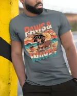 Paws And Waves Dog Beach Graphic T-Shirt Cute Summer Tee - model wearing grey tee, leaning on column