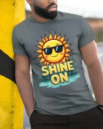 Shine On Sun T-Shirt Positive Summer Graphic Tee Fun - model wearing grey tee, leaning on column