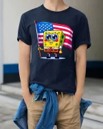 Cute Cartoon Sponge USA Flag T-Shirt Patriotic Graphic - model wearing navy tee with hands in pockets