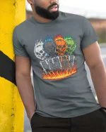 Flaming Skull Skeleton T-Shirt Dark Gothic Fire Graphic - model wearing grey tee, leaning on column