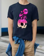 Melting Skull T-Shirt Pink Drip Gothic Graphic Tee - model wearing navy tee with hands in pockets