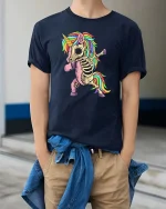 Skeleton Unicorn T-Shirt Funny Rainbow Dabbing Tee - model wearing navy tee with hands in pockets