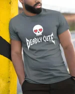 Deadly Cute T-Shirt Skull Heart Eyes Gothic Graphic - model wearing grey tee, leaning on column