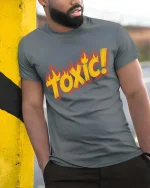Toxic Flame Retro Warning Graphic Bold Style T-Shirt - model wearing grey tee, leaning on column