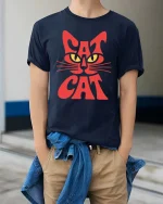 Cat Face Typography Minimalist Cool Animal Graphic Tshirt - model wearing navy tee with hands in pockets