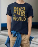 Lost Dinosaur Planet Graphic Adventure Jurassic Style Tshirt - model wearing navy tee with hands in pockets