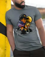 Champion Victory Trophy Cartoon Style Winner Celebration Tshirt - model wearing grey tee, leaning on column