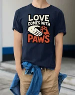 Love Comes With Paws Dog Lover Quote Graphic T-Shirt Tee - model wearing navy tee with hands in pockets