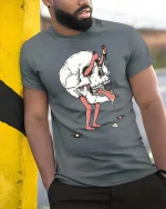 Surreal Skull Character Dark Art Weird Graphic T-Shirt Tee - model wearing grey tee, leaning on column