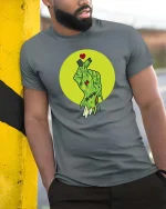 Zombie Hand Heart Gesture Horror Graphic Halloween T-Shirt - model wearing grey tee, leaning on column