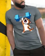 Funny Strong Cat Weightlifting Cartoon Gym Graphic T-Shirt Tee - model wearing grey tee, leaning on column