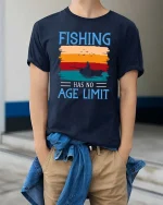 Fishing Has No Age Limit Vintage Sunset Graphic T Shirt - model wearing navy tee with hands in pockets