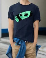 Peeking Alien Funny UFO Extraterrestrial Graphic T Shirt - model wearing navy tee with hands in pockets