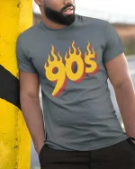 Vintage 90s Flame Retro Style Graphic T Shirt Classic - model wearing grey tee, leaning on column