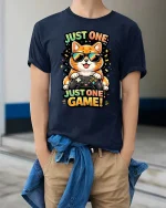 Just One Game Funny Gamer Cat Cartoon Graphic T-Shirt - model wearing navy tee with hands in pockets