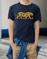 Tiger Word Art Graphic Bold Animal Style Cool T-Shirt - model wearing navy tee with hands in pockets