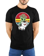 Alien Cowboy Riding Cow Funny Retro Sunset Graphic T-Shirt - model wearing black tee with hands behind back