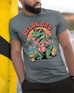 Relax Bro Vintage Dinosaur Beach Sunset Funny Graphic T-Shirt - model wearing grey tee, leaning on column