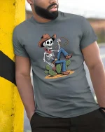 Skeleton Cowboy Lasso Western Desert Funny Graphic T-Shirt - model wearing grey tee, leaning on column