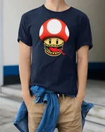 Funny Monster Mushroom Graphic t-shirt Gamer Style Tee - model wearing navy tee with hands in pockets