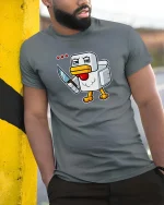 Angry Pixel Chicken Knife Graphic t-shirt Gamer Humor Tee - model wearing grey tee, leaning on column