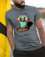 Skateboard RIP Skull Graphic t-shirt Funny Skate Punk Tee - model wearing grey tee, leaning on column