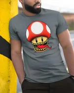 Funny Monster Mushroom Graphic t-shirt Gamer Style Tee - model wearing grey tee, leaning on column