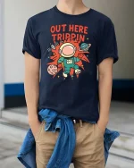 Out Here Trippin Astronaut Space Funny Graphic T-Shirt Tee - model wearing navy tee with hands in pockets