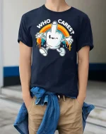 Who Cares Funny Retro Cartoon Hand Graphic T-Shirt Humor - model wearing navy tee with hands in pockets