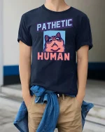 Pathetic Human Funny Cat Meme Graphic T-Shirt Humor Tee - model wearing navy tee with hands in pockets