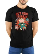 Out Here Trippin Astronaut Space Funny Graphic T-Shirt Tee - model wearing black tee with hands behind back