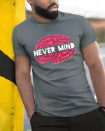 Never Mind Brain Funny Sarcastic Graphic T-Shirt Humor Tee - model wearing grey tee, leaning on column