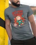 Out Here Trippin Astronaut Space Funny Graphic T-Shirt Tee - model wearing grey tee, leaning on column