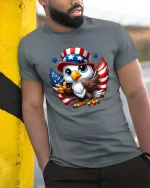 Cute American Eagle Patriotic Cartoon USA Flag T Shirt - model wearing grey tee, leaning on column