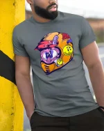 Funny Cartoon Racing Helmet Character Color Splash T Shirt - model wearing grey tee, leaning on column