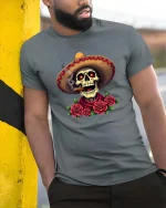 Mexican Skull Sombrero Smoking Cigar Roses Graphic T Shirt - model wearing grey tee, leaning on column