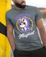 Cute Unicorn Cat Stressed But Still Magical Funny T Shirt - model wearing grey tee, leaning on column