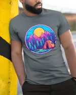 Mountain Camping Sunset Forest Adventure Graphic T Shirt - model wearing grey tee, leaning on column