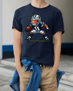 Football Player Action Cartoon Graphic Tshirt Game Day - model wearing navy tee with hands in pockets