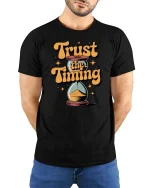 Trust The Timing Motivational Quote Graphic Tshirt Style - model wearing black tee with hands behind back