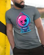 Neon Bomb Smile Street Art Cartoon Graphic Tshirt Style - model wearing grey tee, leaning on column