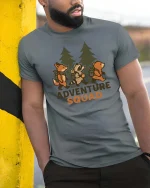 Adventure Squad Forest Animals Hiking Graphic Tshirt Fun - model wearing grey tee, leaning on column