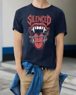 Silenced Mouth Barbed Wire Dark Horror Graphic Tshirt - model wearing navy tee with hands in pockets