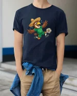 Funny Eagle Soccer Player Mexico Fan Cartoon Tshirt - model wearing navy tee with hands in pockets