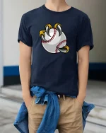 Baseball Claw Grip Funny Sports Fan Cartoon Graphic Tshirt - model wearing navy tee with hands in pockets