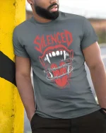 Silenced Mouth Barbed Wire Dark Horror Graphic Tshirt - model wearing grey tee, leaning on column