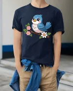 Cute Blue Bird On Flower Branch Cartoon Graphic Tshirt - model wearing navy tee with hands in pockets