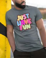 Just Have Fun Tshirt Colorful Positive Quote Graphic Tee - model wearing grey tee, leaning on column