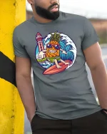 Funny Surfing Pineapple Beach Vibes Summer Graphic Tshirt - model wearing grey tee, leaning on column